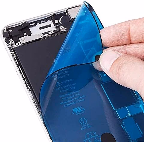 Blue adhesive gasket film being peeled away from an opened phone chassis